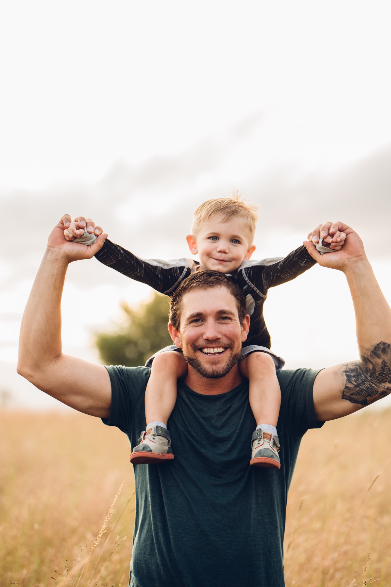 Minnesota father and child in a field during family portrait session 