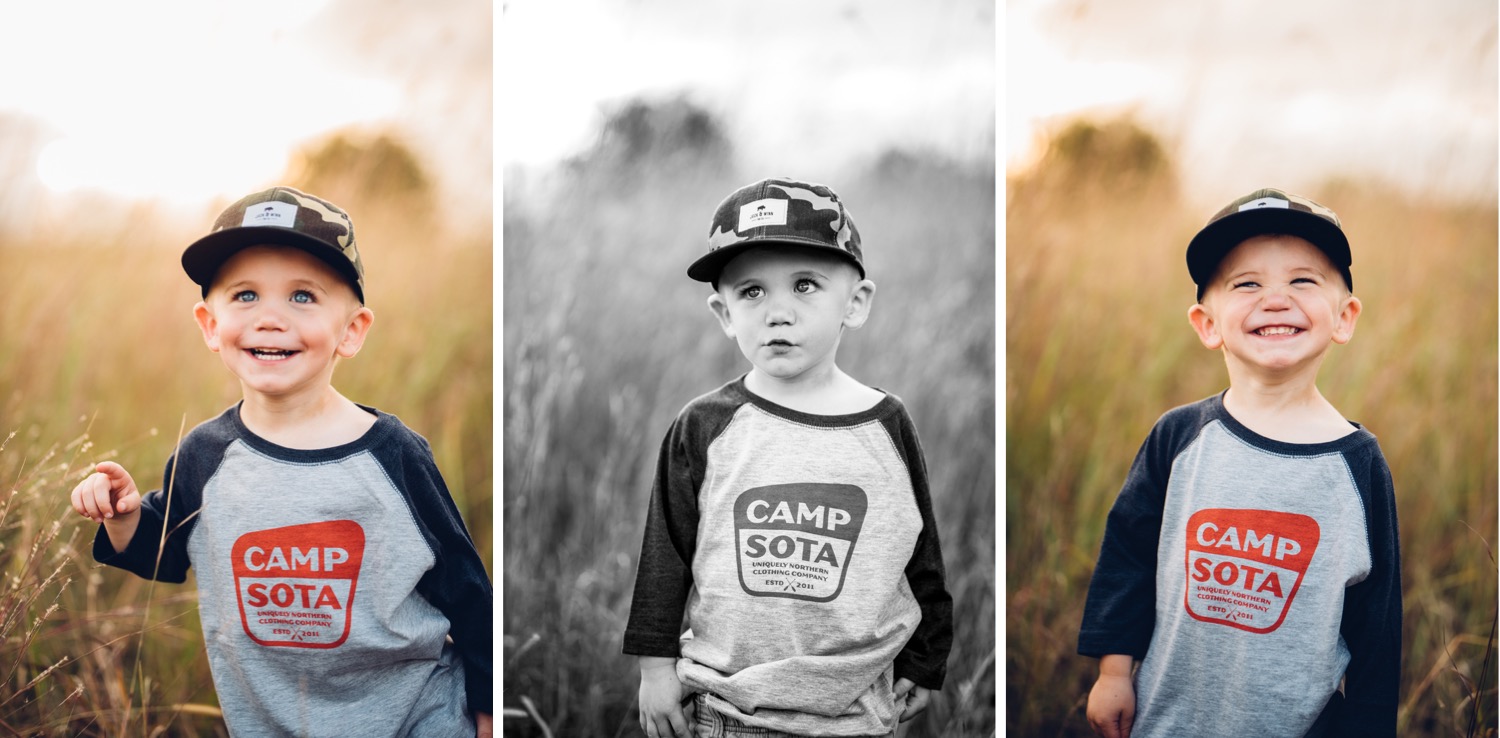 Toddler boy wearing Sota Clothing and Jack and Winn apparel in a field during minnesota family photo session.